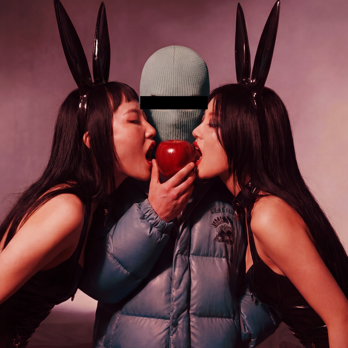 Minkohan cover art · two figures in bunny ears sharing a red apple beside a masked man